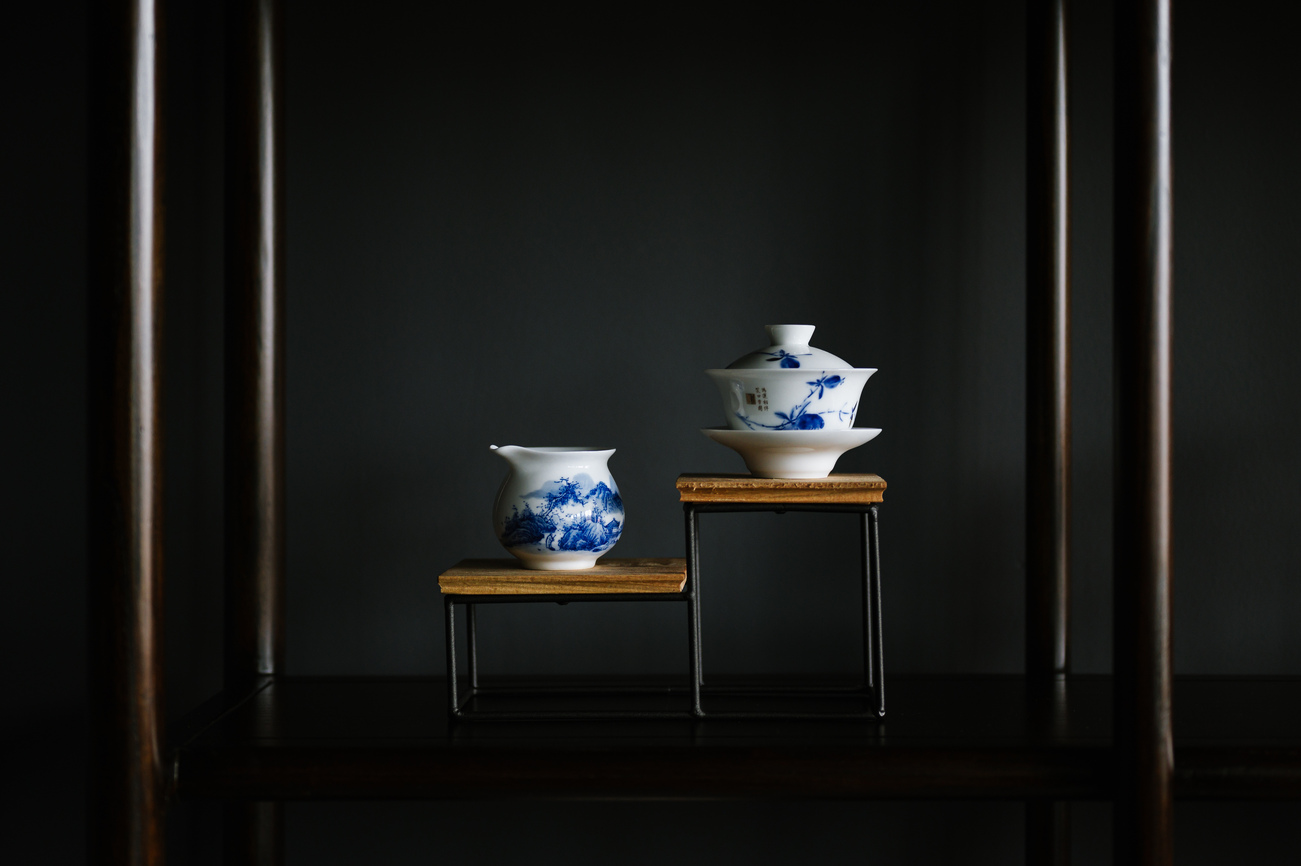 Jingdezhen porcelain teaware : Luminous porcelain teacup in Tea Room Singapore reflecting centuries of craftsmanship