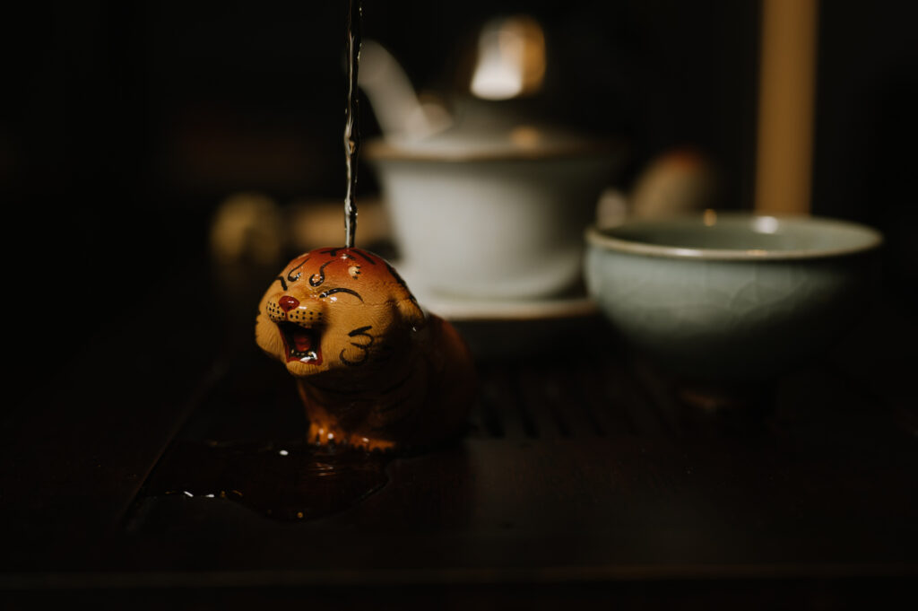 Luxury Chinese Tea : A calm tea house interior in Singapore, where light, wood, and steam create quiet elegance.