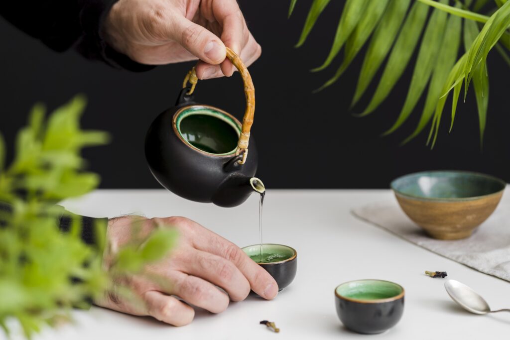 Tea Store in SG : A tea master carefully brewing fresh leaves, surrounded by the gentle steam and aroma of high-quality teas sourced from China, Japan, and Taiwan.