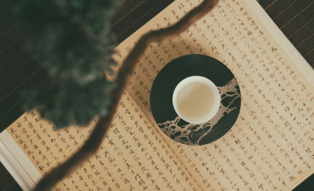 Luxury Chinese Tea : A serene tea ceremony setup with fine china and rising steam in a tranquil tearoom.
