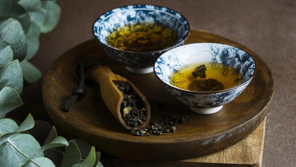 Tea Store in SG : A tea sommelier arranging premium loose-leaf teas by origin and aroma, illustrating the attention to detail in Singapore’s artisanal tea culture.