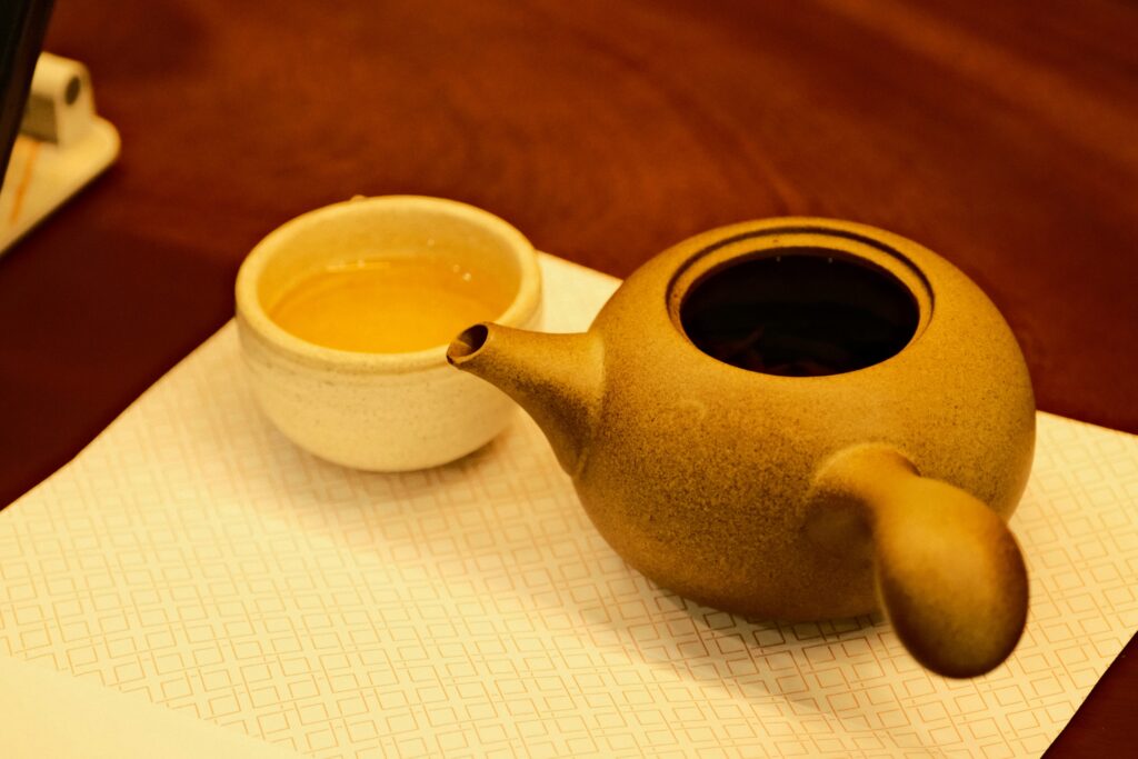 Exquisite Jingdezhen porcelain teaware displayed on a wooden table, featuring fine craftsmanship, intricate detailing, and the timeless elegance of China’s most renowned ceramic heritage.