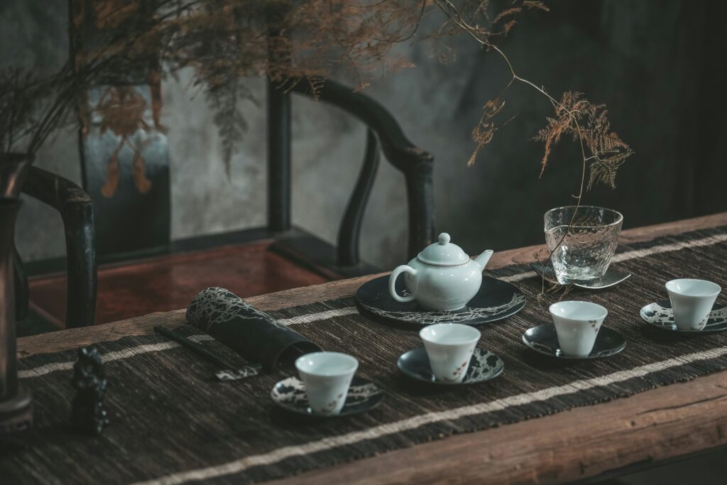 An intimate and serene tea ceremony room designed with natural materials, soft lighting, and minimalist décor, creating a peaceful space for traditional tea appreciation.