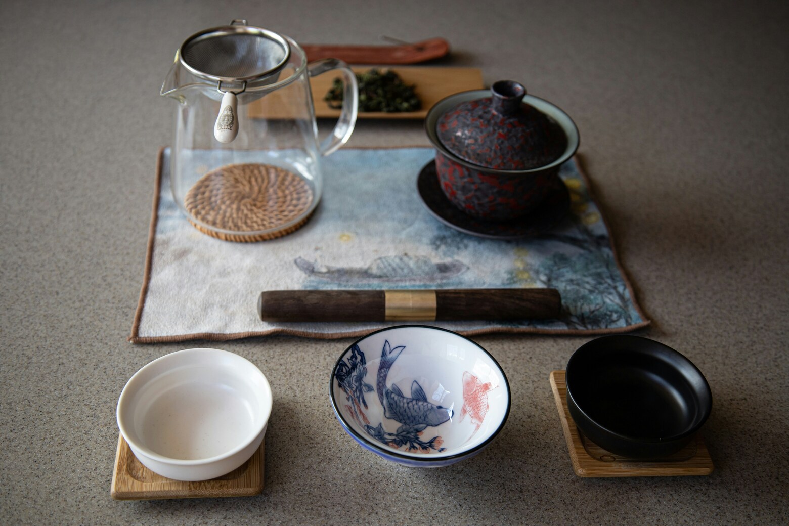 The image showcases a traditional Chinese tea ceremony setup, featuring a gaiwan, a fairness cup, and small tasting cups elegantly arranged on a wooden tea tray. This serene display highlights the art of tea preparation, embodying the cultural history and respect for purity associated with tea ceremonies.