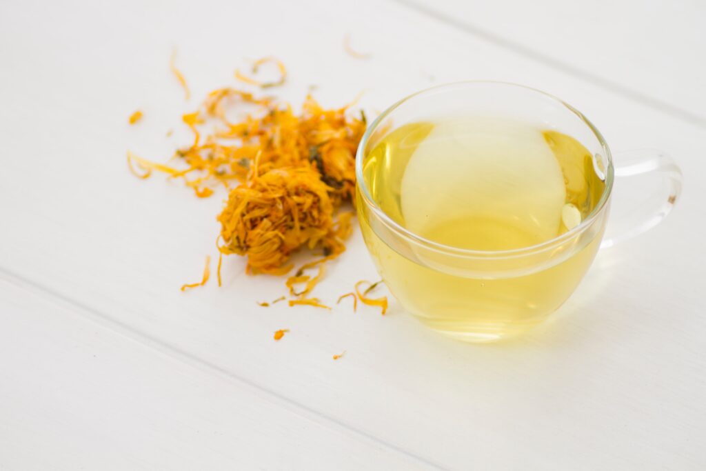 A smooth cup of yellow tea, softly golden, representing this rare Chinese tea known for aiding digestion.