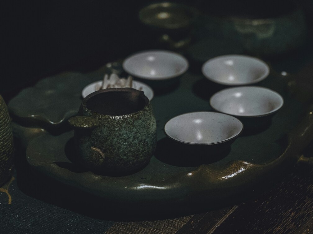 Essential tea ceremony tools arranged neatly—teapot and teacups prepared in harmony, reflecting balance, tradition, and craftsmanship.