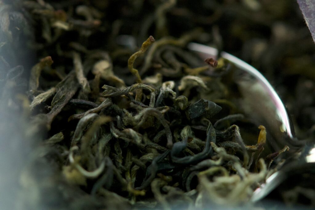 Close-up of premium dry tea leaves, carefully selected and naturally dried, revealing their rich texture, colour, and artisanal quality before brewing.