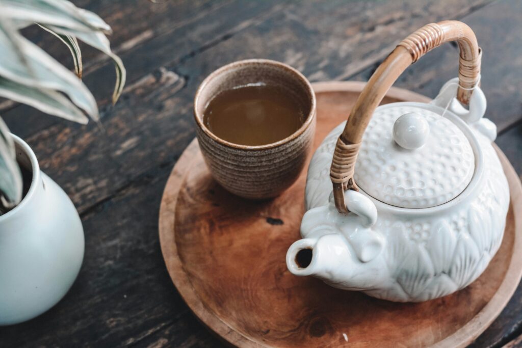A cup of warm tea releasing gentle steam, capturing a moment of calm, comfort, and quiet indulgence.