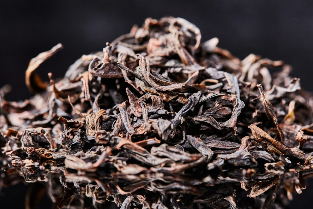 A close-up of premium Chinese tea leaves, showcasing their natural texture and superior quality.