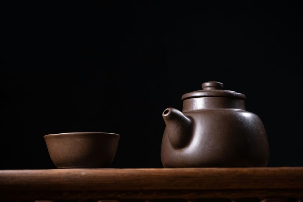 A classic Yixing clay teapot, prized for its porous texture that absorbs tea essence and enriches flavour over time through repeated use.