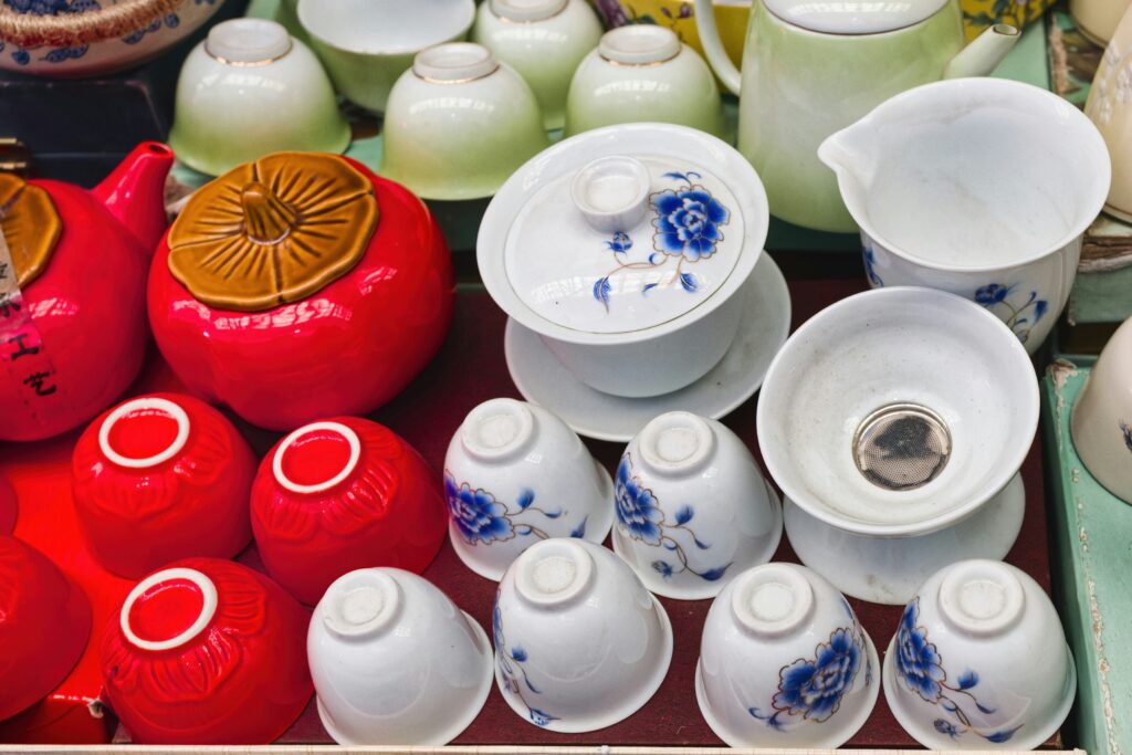 A curated set of tea cups in mixed colours and styles, celebrating the beauty of variation and shared tea moments.