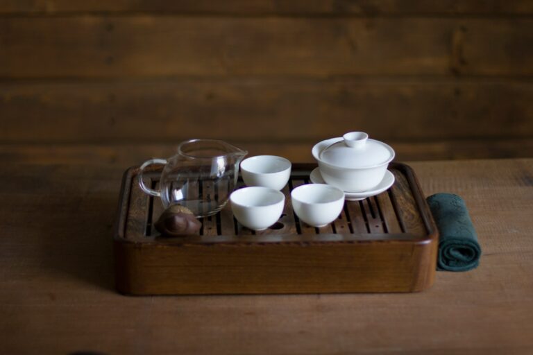 A refined porcelain tea set arranged in a modern tea room, reflecting Singapore’s blend of traditional Chinese tea culture and contemporary lifestyle.