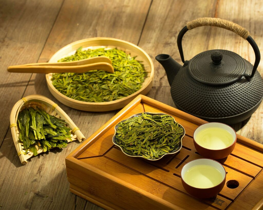 Fresh green tea leaves lightly heated to stop oxidation, maintaining their vibrant colour and grassy, clean flavour profile.