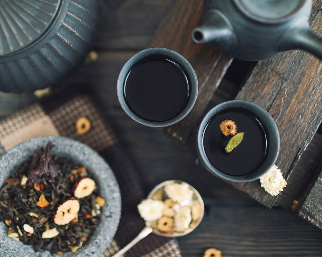 A close-up view of tea inside a teacup, focusing on the rich colour of the liquid and the smooth rim of the cup, evoking a sense of warmth and peaceful enjoyment.